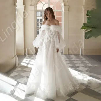 A elegante linha de tulle sexy off-a-ombro, off-the-volta de manga longa decalque princesa noiva Personalizado vestido de noiva Vestidos de noiva
